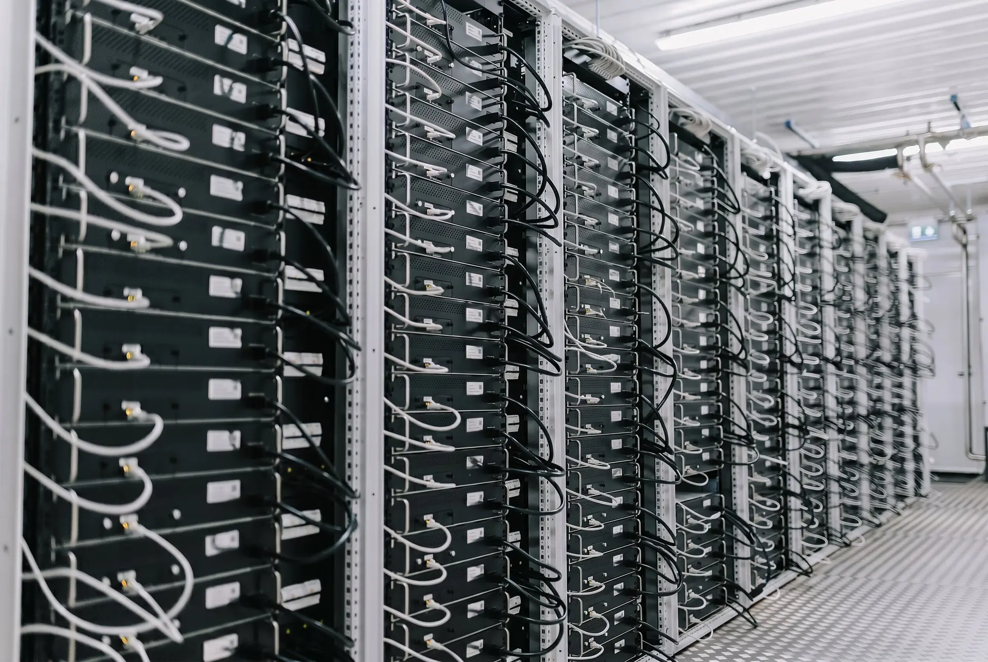 Rows of Bitcoin miners in a mining facility